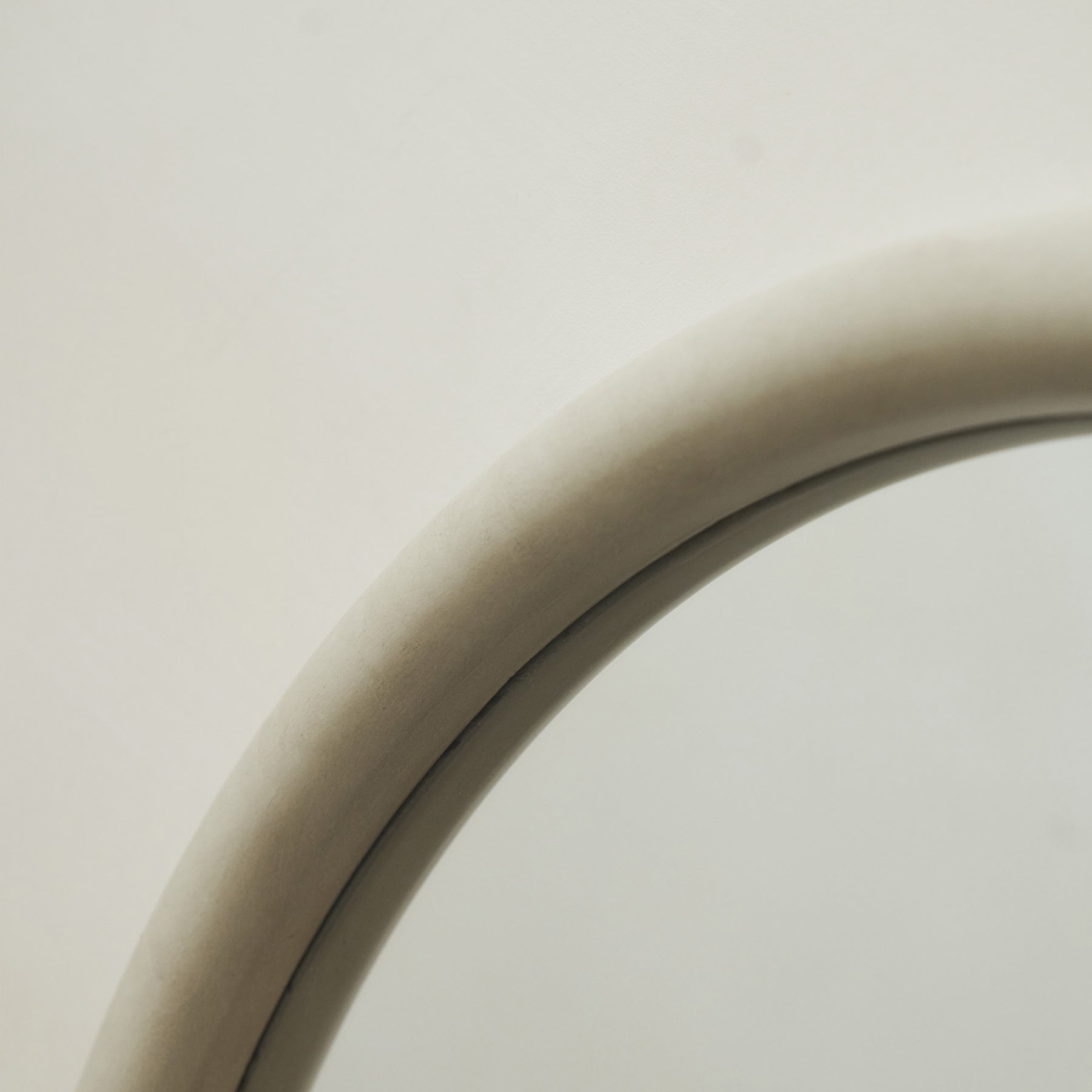 Detail shot of Concrete Round Wall Mirror curved frame