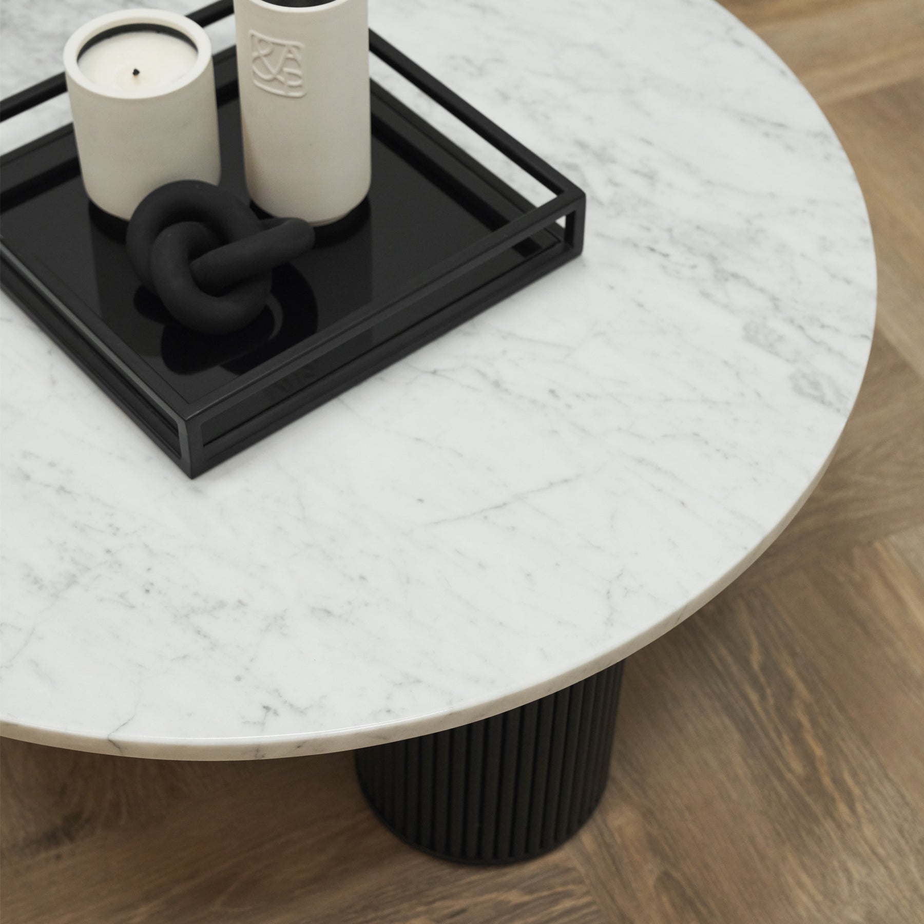 Marble Round Large Coffee Table adorned with candles and minimalistic decor