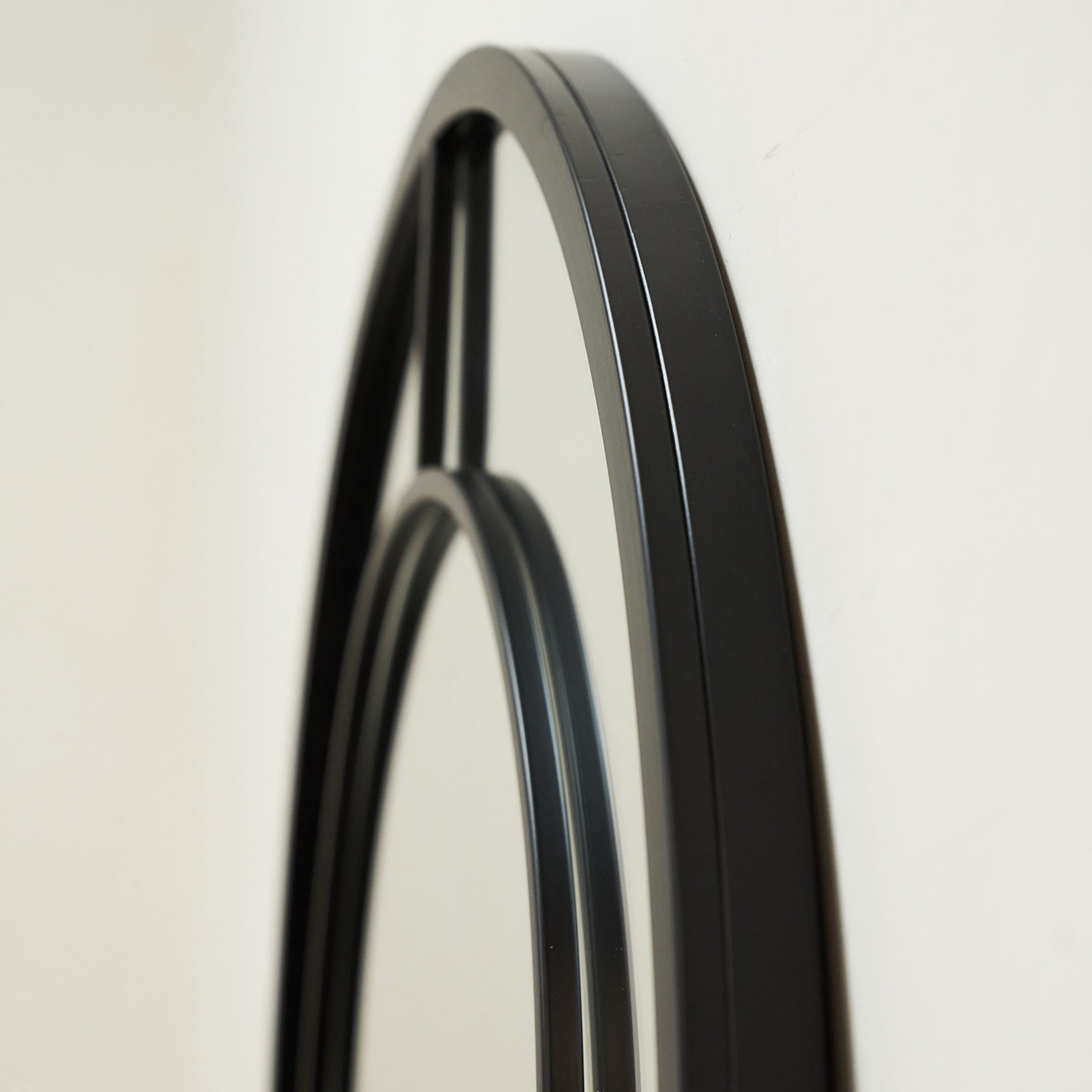 Closeup of Black Industrial Full Length Arched Metal Mirror side profile