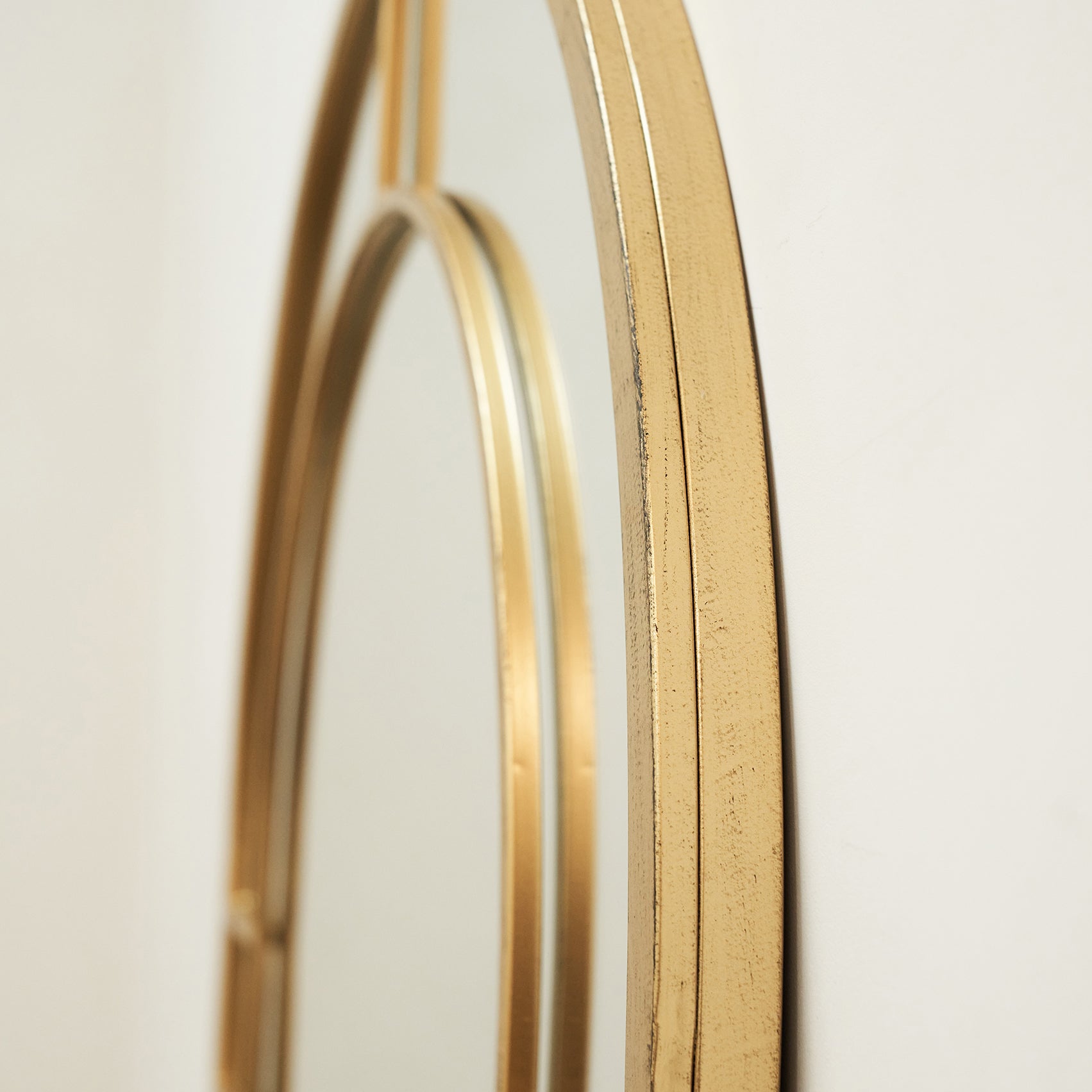 Closeup of Gold Industrial Full Length Arched Metal Mirror side profile