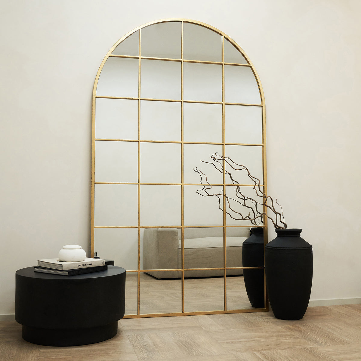 Full Length Extra Large Gold Arched Metal Window Mirror leaning against wall