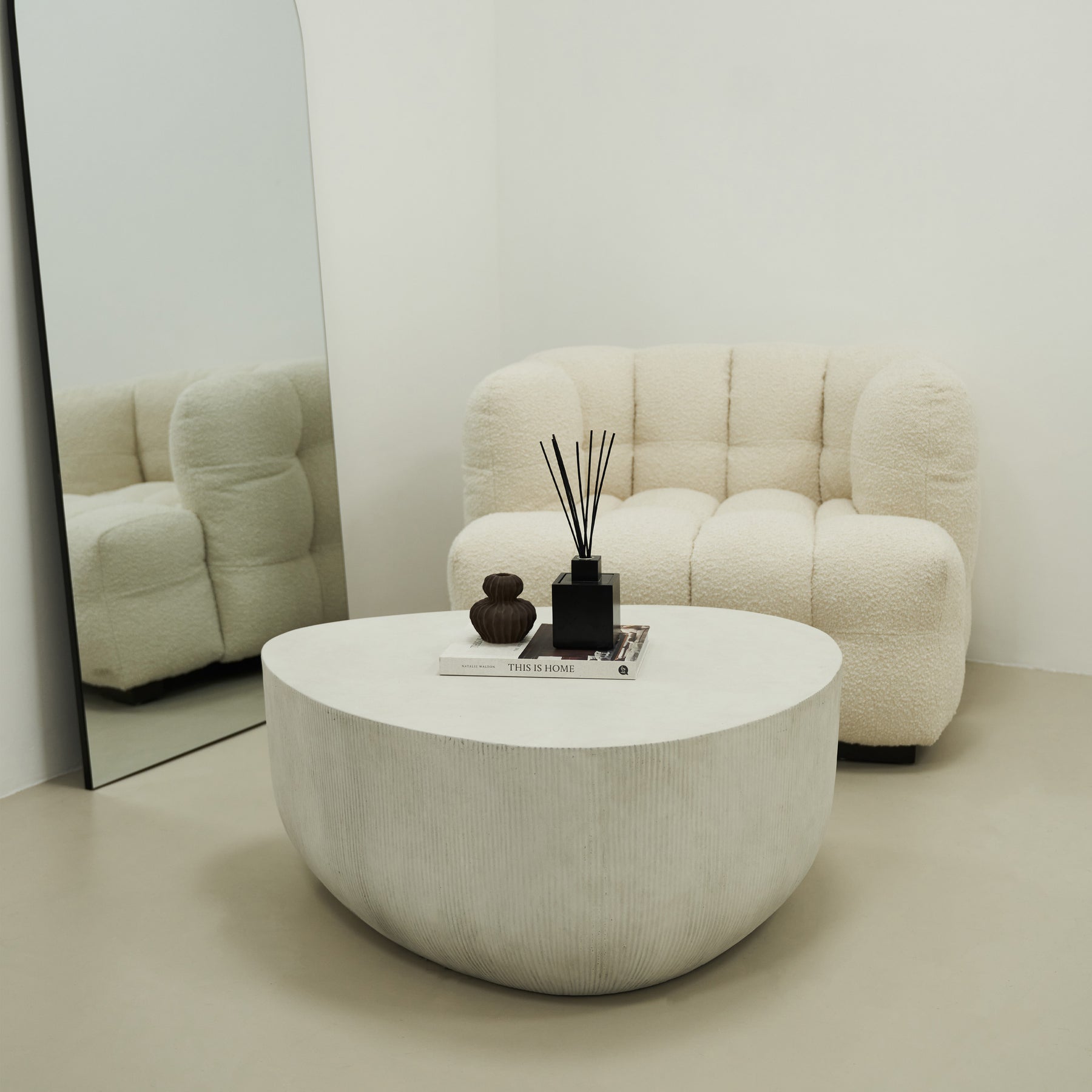 Alternate shot of Minimal Concrete Irregular Shaped Coffee Table Large in typical setting