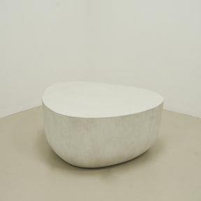 Minimal Concrete Irregular Shaped Coffee Table Large in muted room, empty