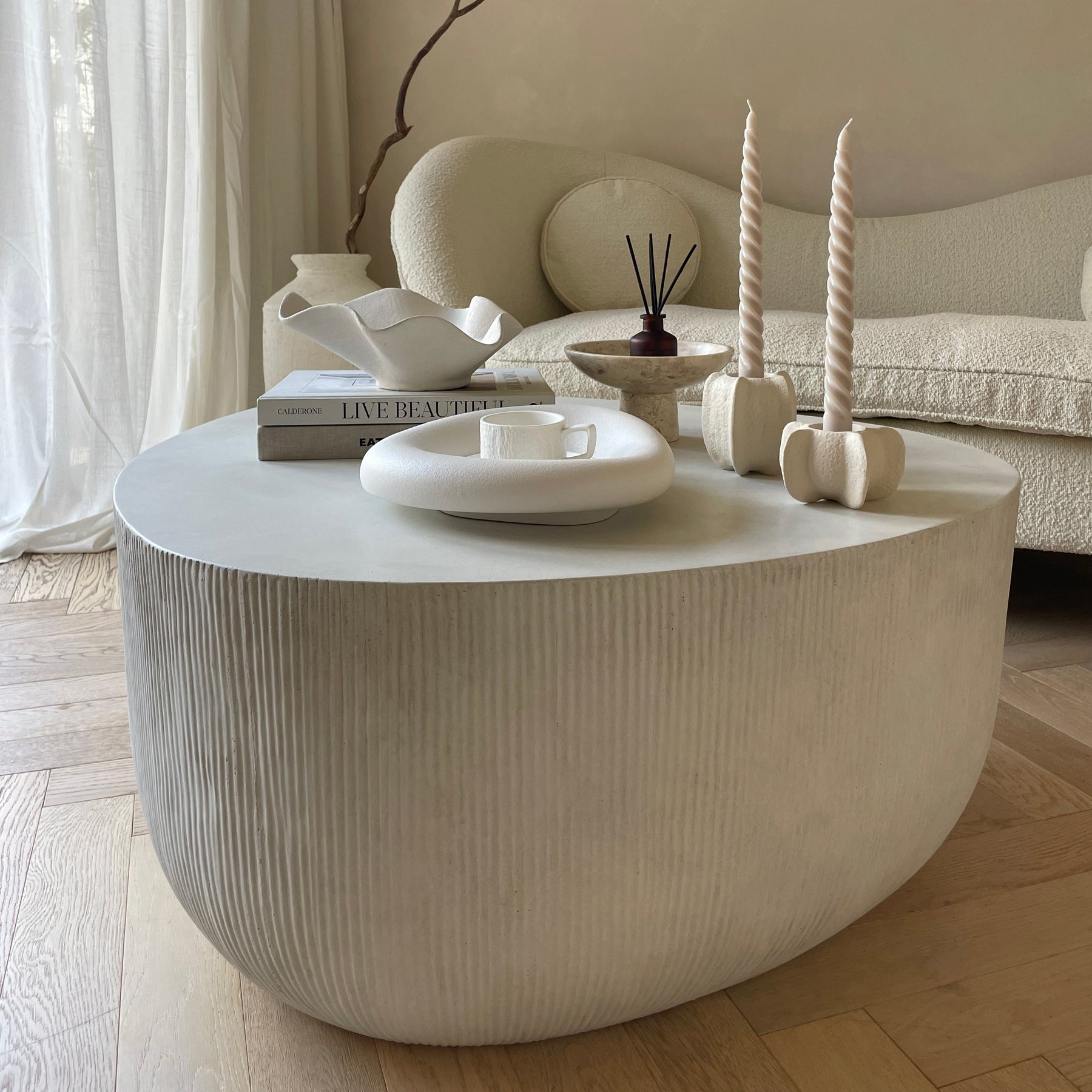 Minimal Concrete Irregular Shaped Coffee Table Large decorated with various accessories
