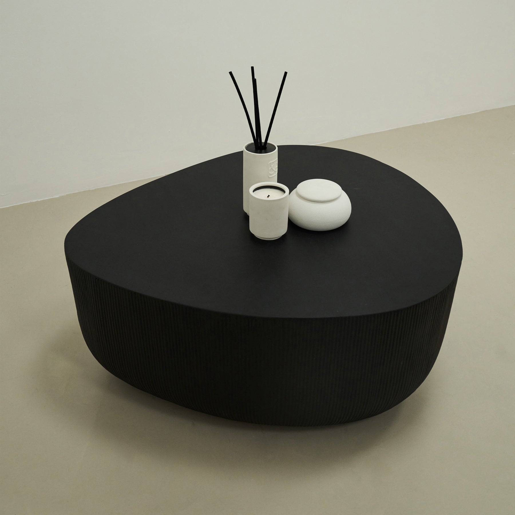 Minimal Onyx Irregular Shaped Coffee Table Large in muted room, decorated with candles and incense