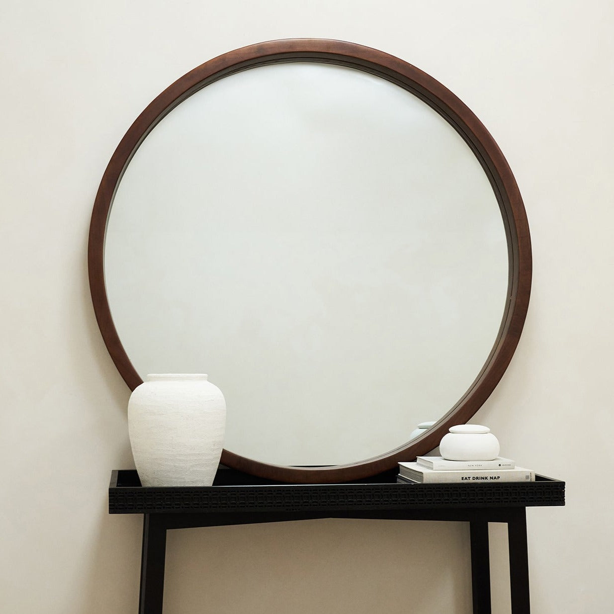 Extra Large Walnut Round Wall Mirror leaning against wall