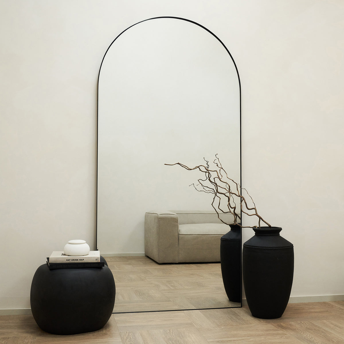 Full Length Extra Large Black Arched Metal Mirror leaning against wall