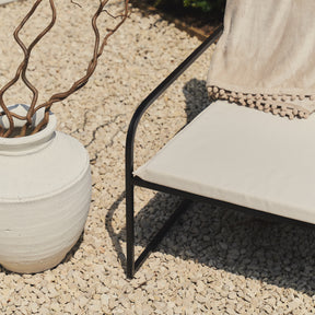 Sand Modern Rounded Garden Chair on gravel