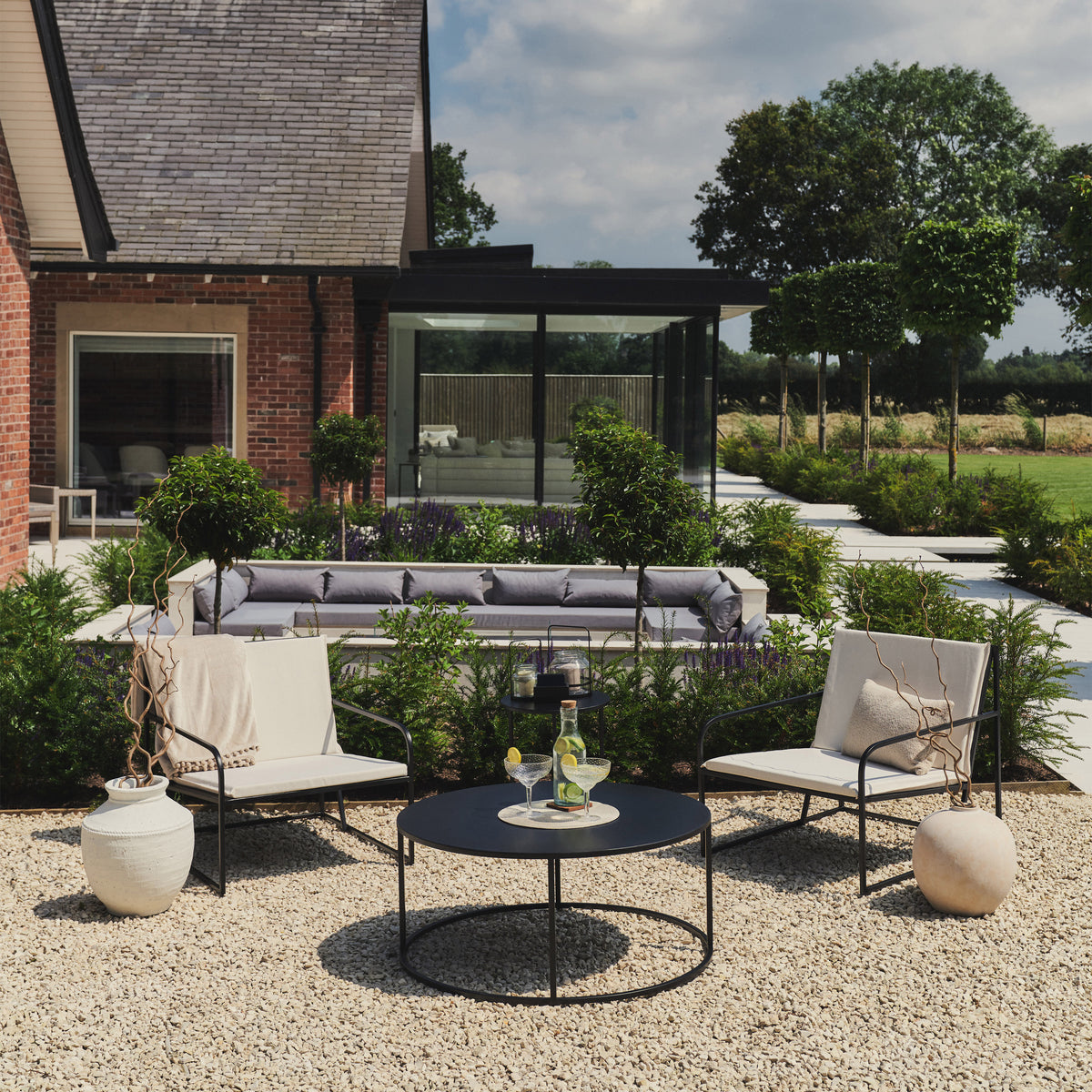 Our Sand Modern Rounded Garden Furniture Set in a typical setting