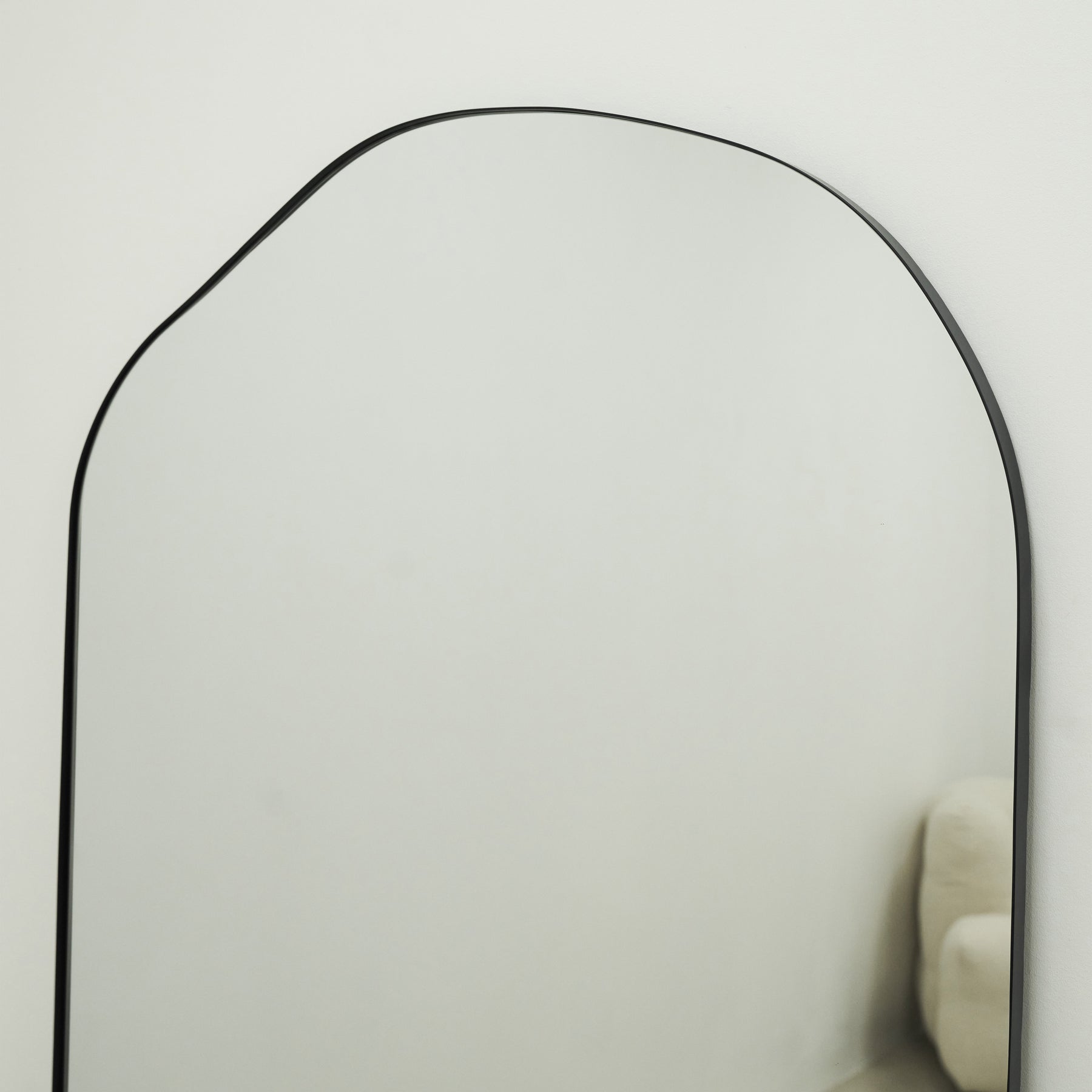 Top half view of Large Full Length Irregular Arched Black Metal Mirror