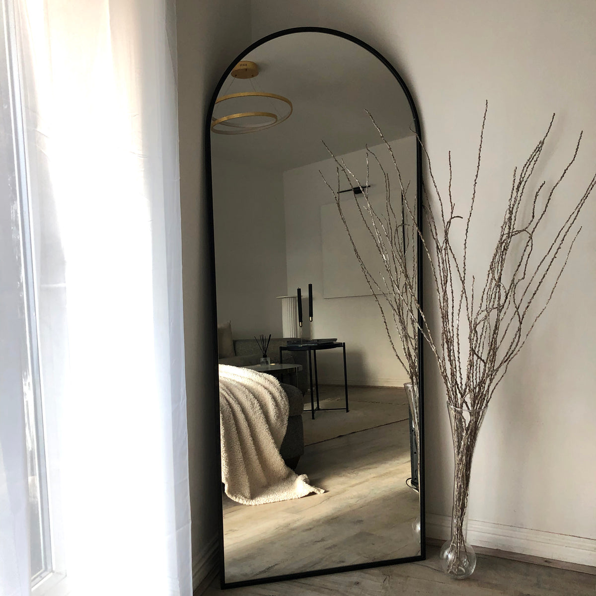 Black Full Length Arched Metal Mirror as bedroom lean to